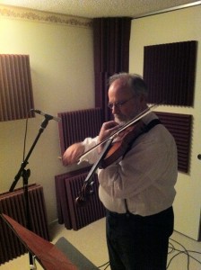 Freeman playing fiddle for "Water is Wide"